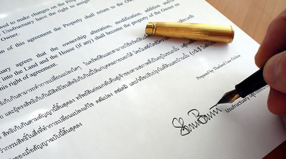 close-up of signing Thai English usufruct contract